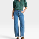 JONES + CO Jess Blouse in green Muir tartan with short puff sleeves, pintuck details, and a curved hemline.