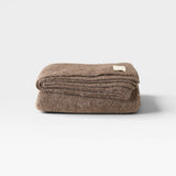 JONES + CO Jones Blanket in bark, a medium-weight alpaca wool blend throw with a soft texture.