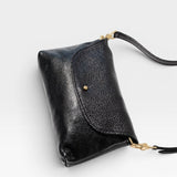 JONES + CO Kaanapali Crossbody in black metallic aniline leather with brass hardware and collar button closure.