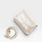 JONES + CO Kaanapali crossbody bag in champagne metallic aniline leather with a detachable strap.
