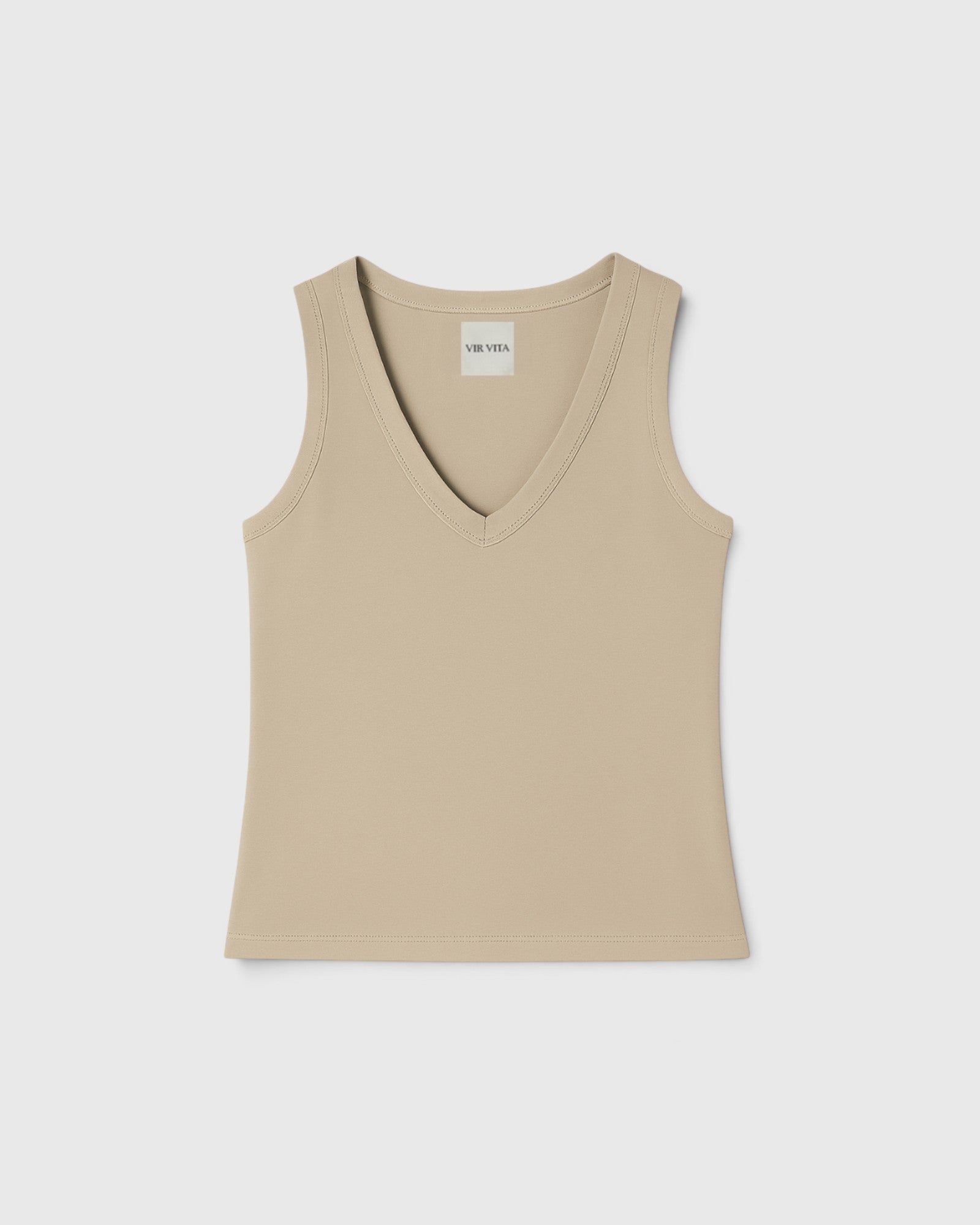 JONES + CO Kana Tank in dune beige with a deep scoop neckline and ribbed knit fabric in a fluid, close fit.