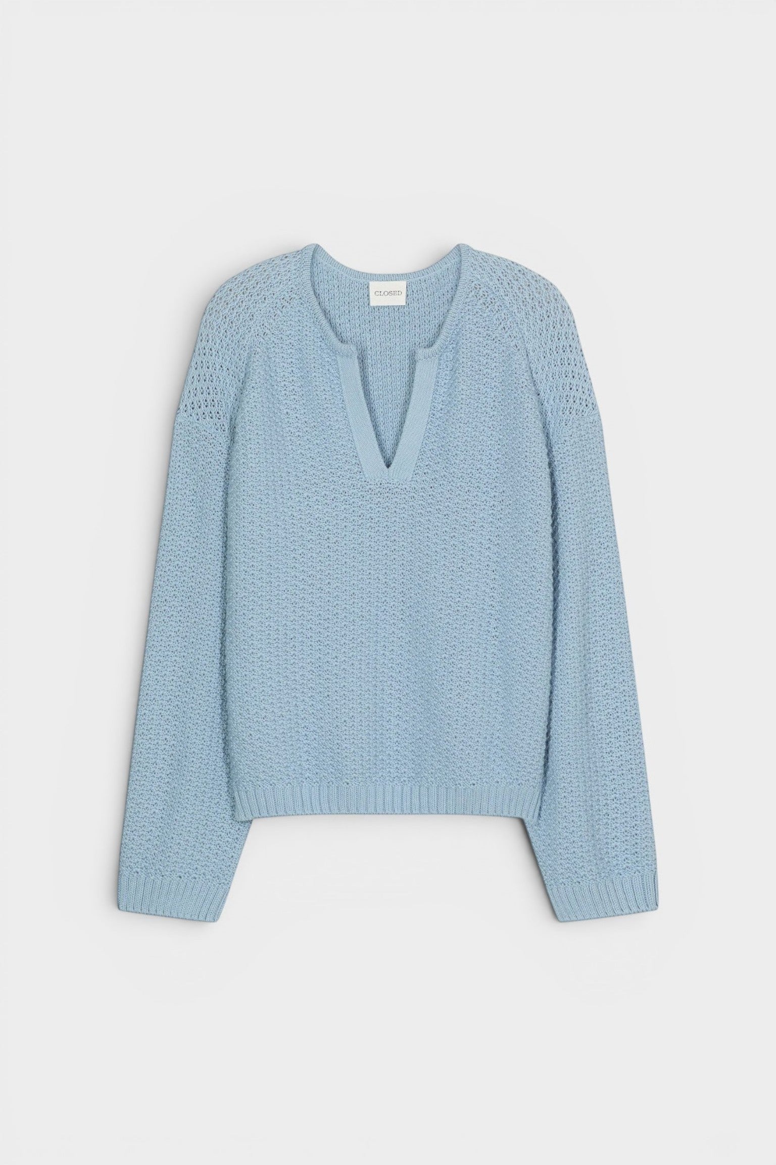 JONES + CO dove blue organic cotton knitted jersey with 3D effect stripe pattern and V-neck.