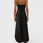 JONES + CO Kortez black balloon pants in viscose satin with an elasticated waist and hem, back view on a model.