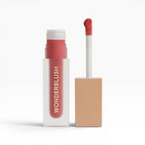 JONES + CO La Laque Tinted Lip Oil in a coral shade, with a frosted glass tube and gold lettering.