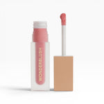 JONES + CO La Laque Tinted Lip Oil in a sheer pink shade, with a frosted glass bottle and gold lettering.