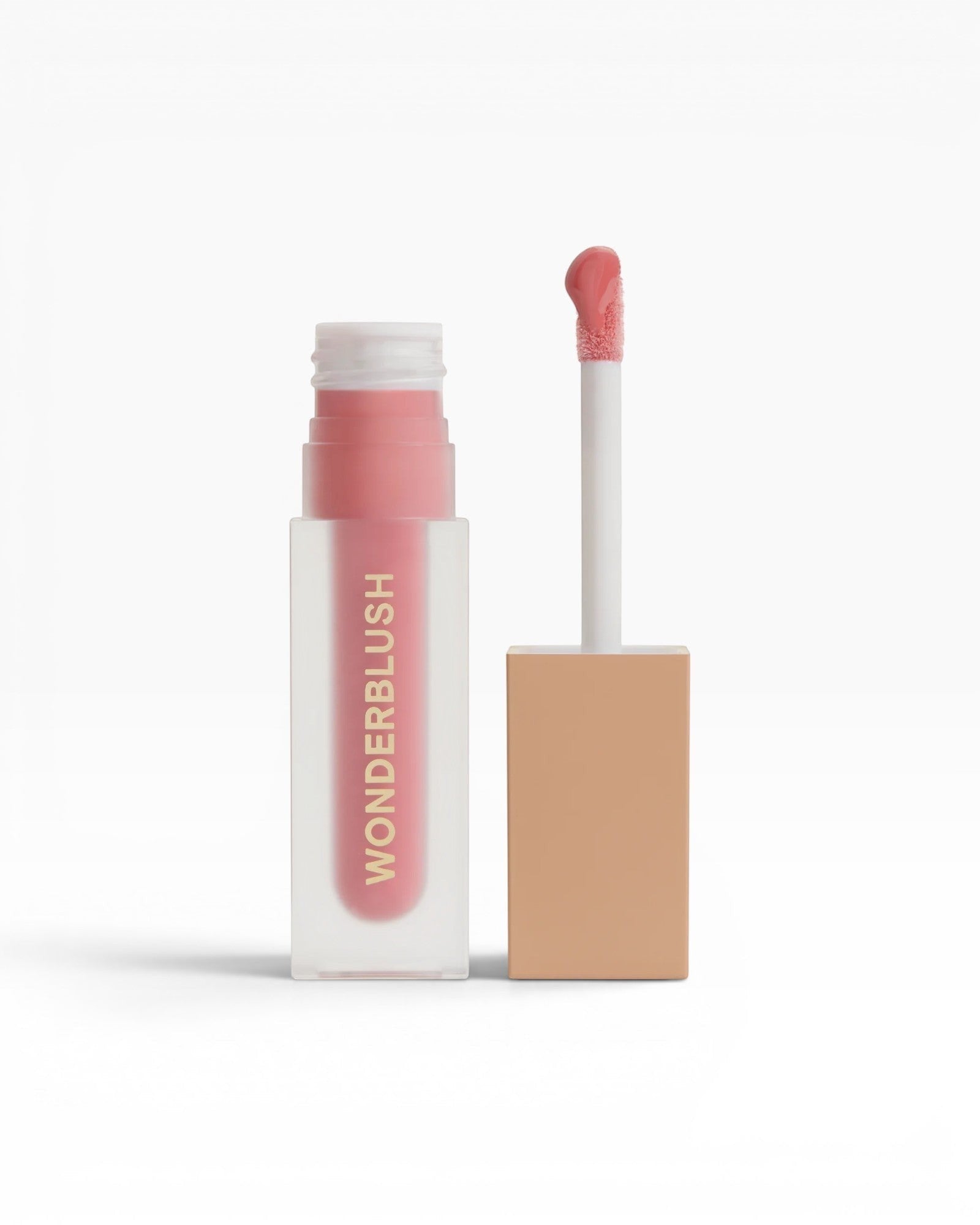 JONES + CO La Laque Tinted Lip Oil in a sheer pink shade, with a frosted glass bottle and gold lettering.