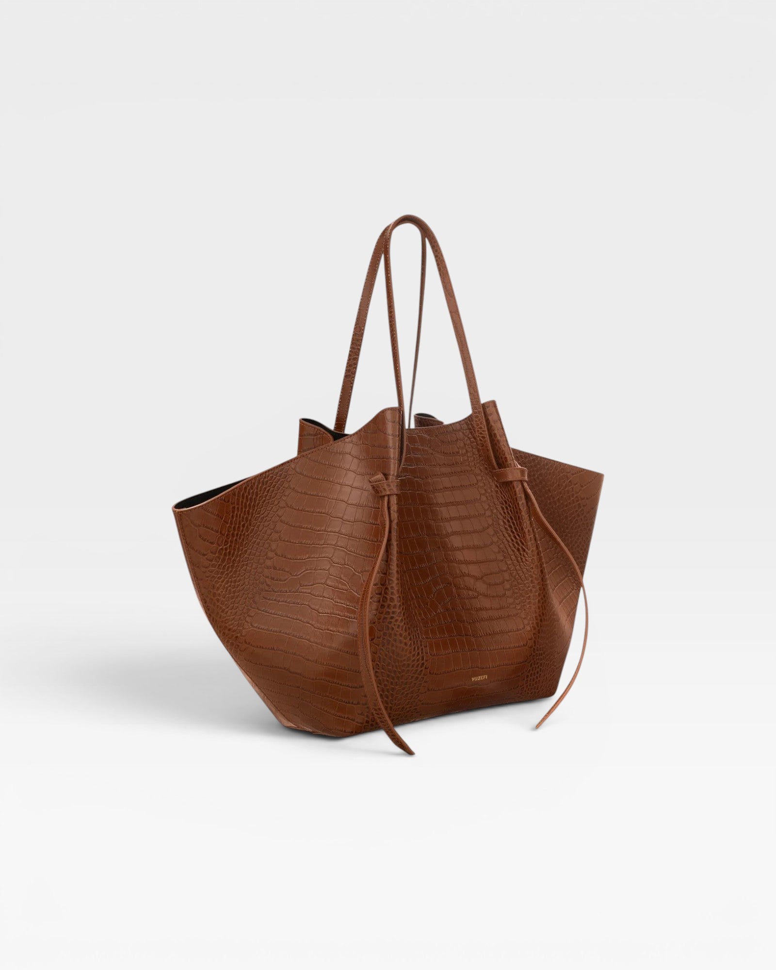 JONES + CO Large Mochi tote bag in brown embossed sierra leather with organic folds and knotted side details.
