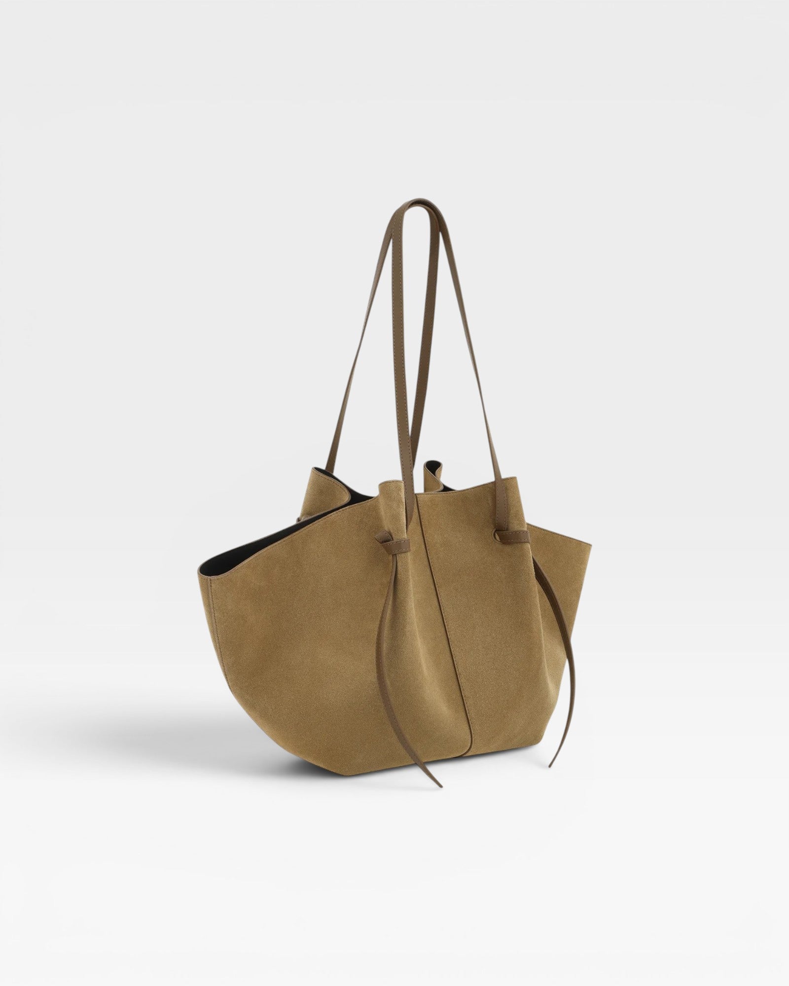 JONES + CO Large Mochi tote bag in fennel suede with organic curves, folds, and long shoulder straps.