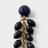 JONES + CO Laurel drop earrings featuring glossy black acrylic beads hanging from delicate gold-tone chains.