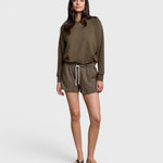 JONES + CO Layla dark olive French terry lounge shorts with elastic waistband and raw edge hem on a model