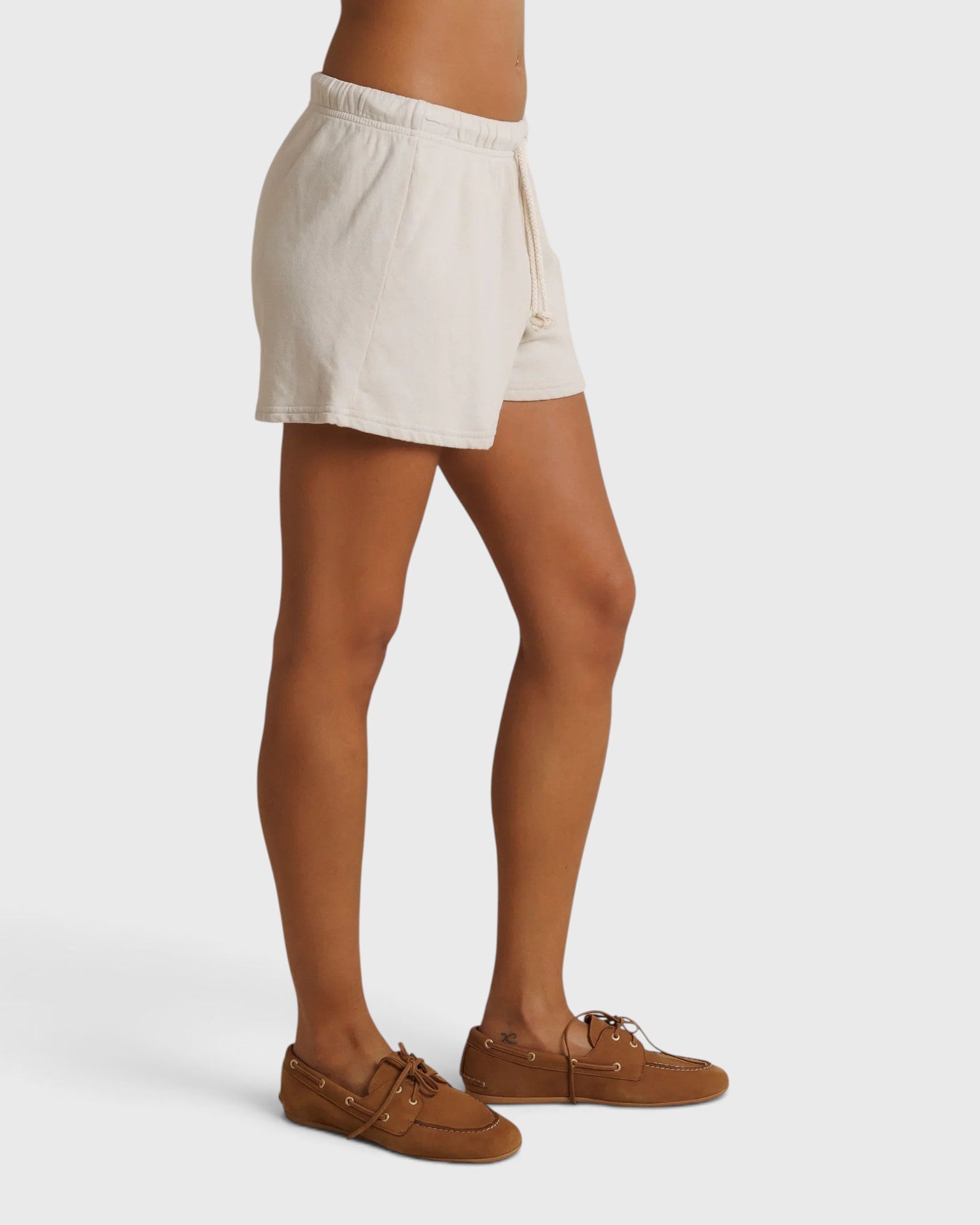 JONES + CO Layla French Terry sweat shorts in whitecap grey with a raw hem and natural drawcord, side view.