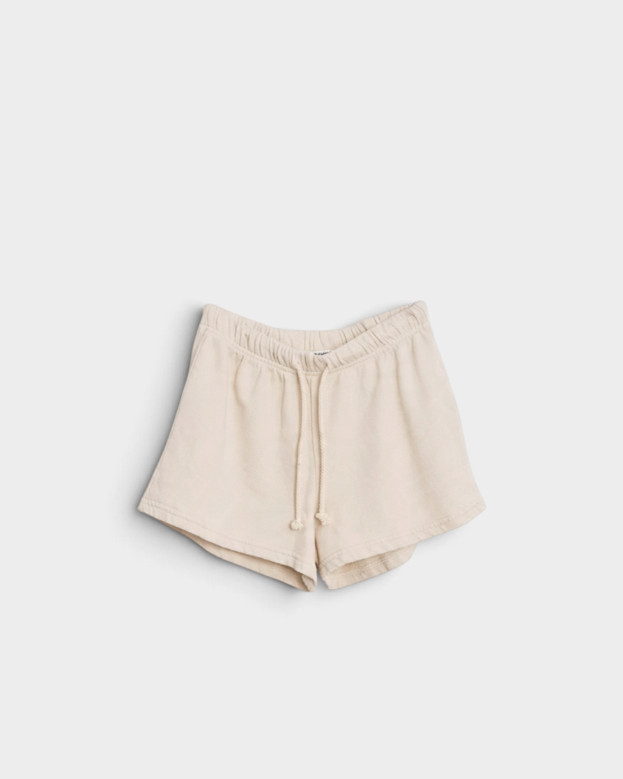 JONES + CO Layla French Terry sweat shorts in sugar beige with an elastic waistband, drawcord, and raw edge hem.