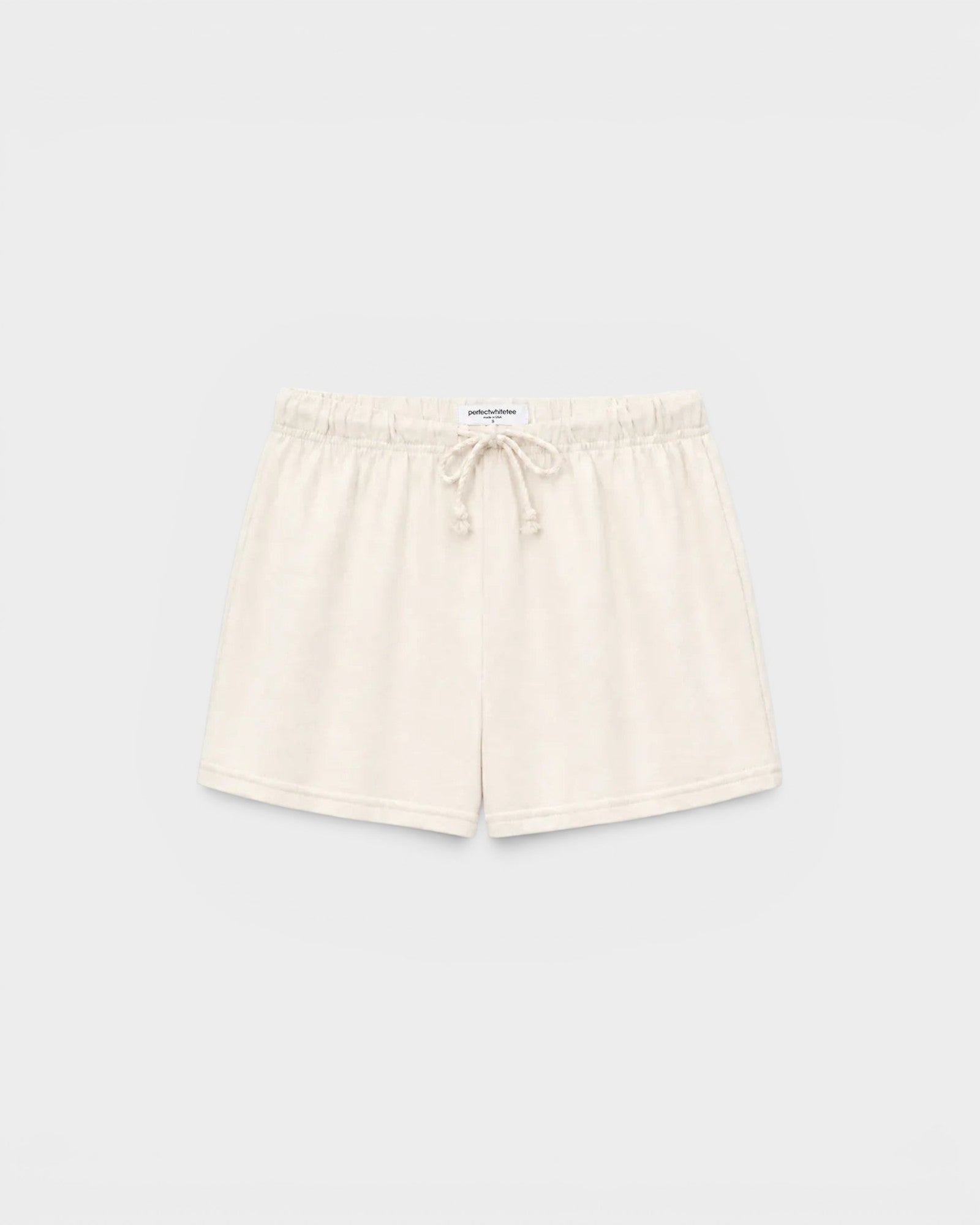 JONES + CO Layla bright ivory French terry lounge shorts with an elastic waistband, drawcord, and raw edge hem.