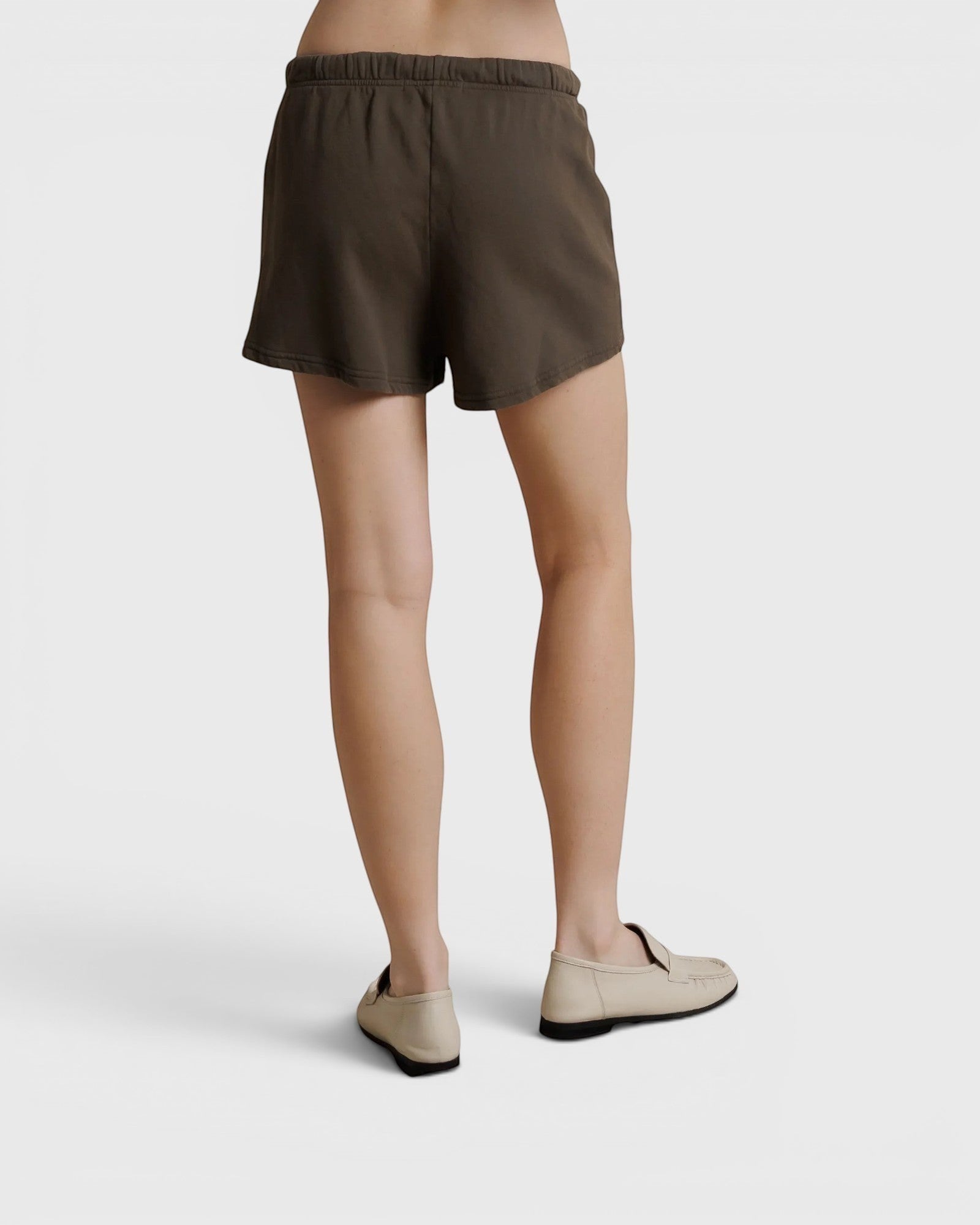 JONES + CO Layla dark olive French terry lounge shorts with elastic waistband and raw edge hem, back view