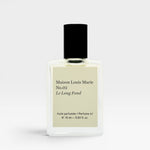 JONES + CO No.02 Le Long Fond perfume oil in a clear glass bottle with a black cap. Notes of hinoki wood, cedarwood, patchouli, and musk.
