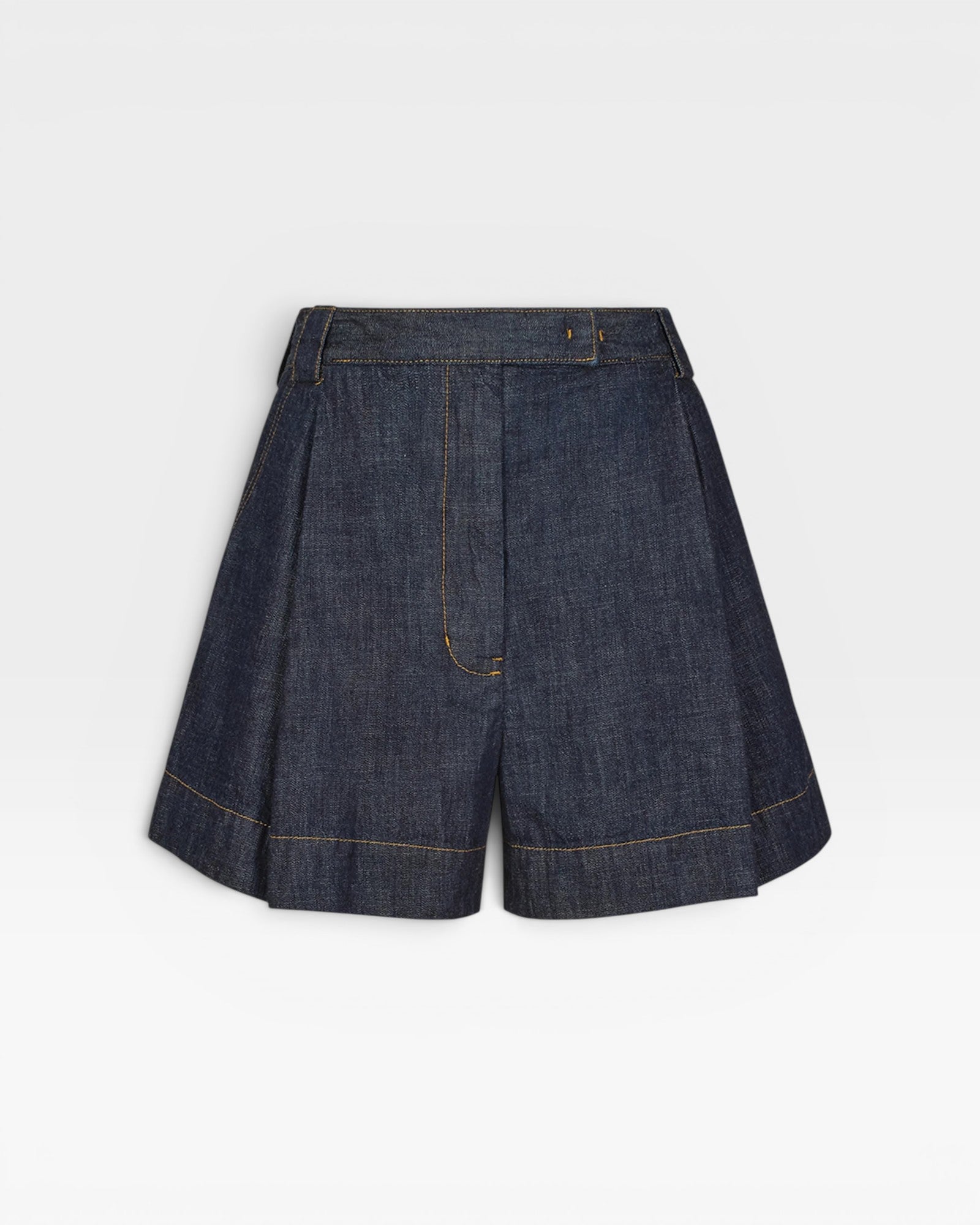 JONES + CO high-waisted Leo denim shorts in raw wash with pleated front and contrast stitching.
