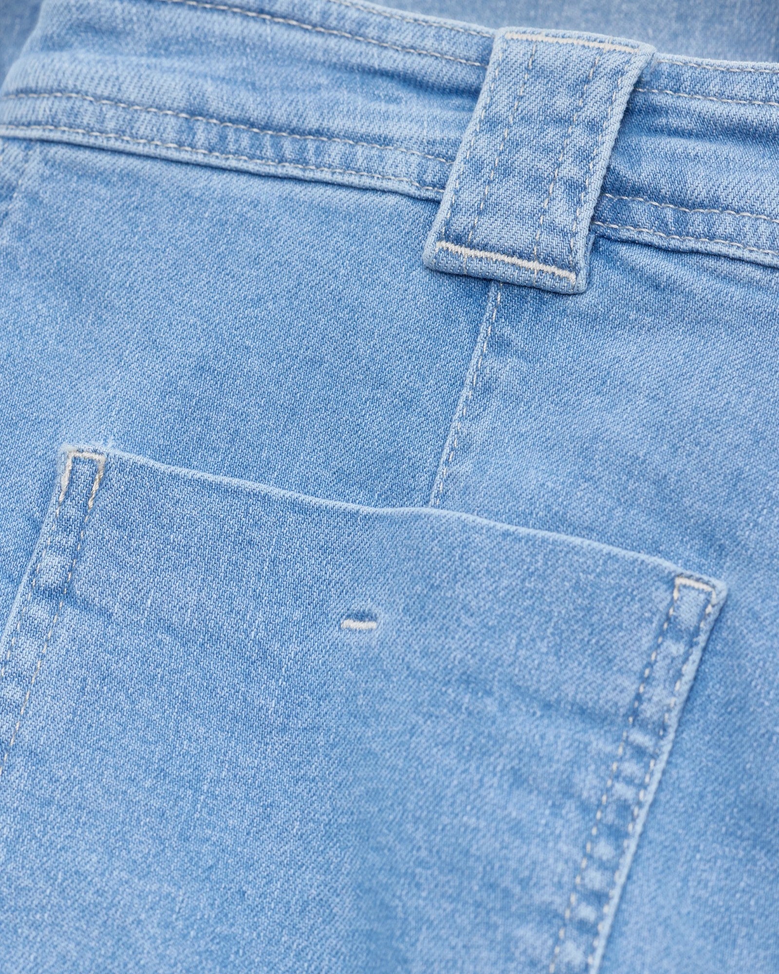 JONES + CO light blue flared jeans featuring a patch pocket, wide belt loop, and light contrast stitching.