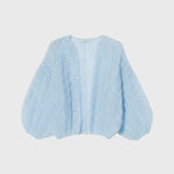JONES + CO light blue mohair bomber cardigan with a ribbed texture and voluminous sleeves on a plain background.