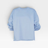 JONES + CO light blue crewneck sweatshirt with drop shoulders, cropped sleeves, and a raw edge hemline.
