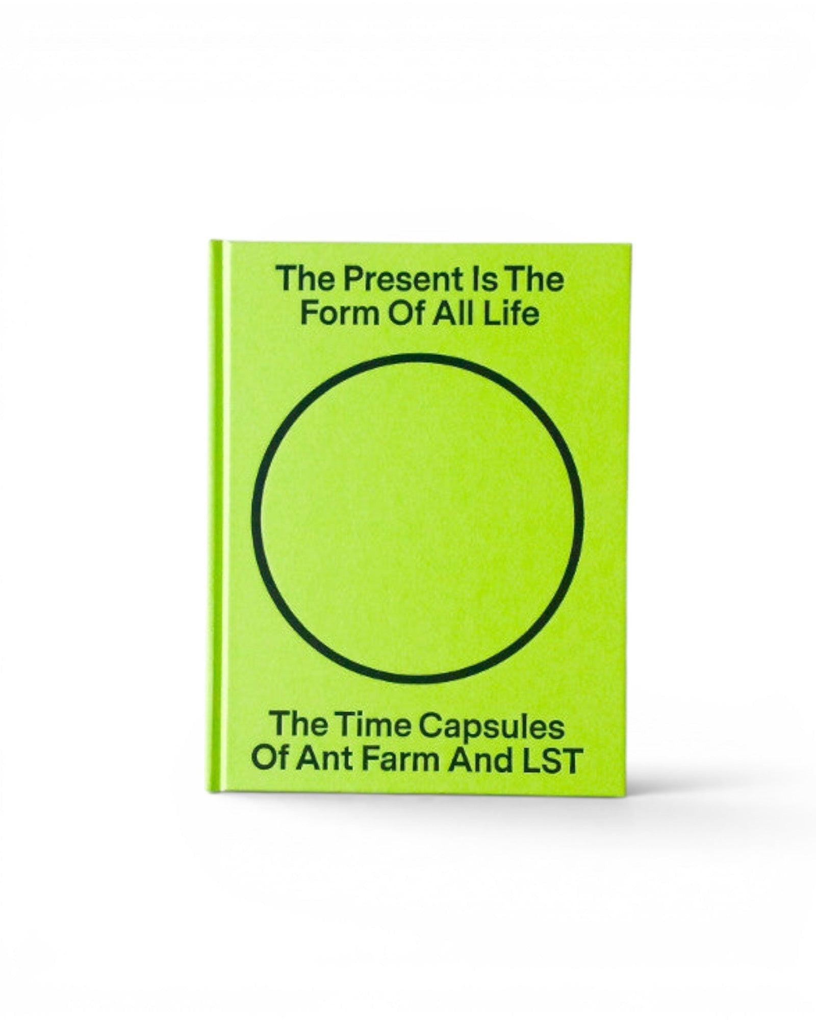 JONES + CO book titled The Present Is the Form of All Life with a bright lime green cover and black circle graphic.
