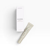 JONES + CO white box and light beige lip care tube with text "∞ LAYERS LIP CARE SOIN POUR LES LEVRES"