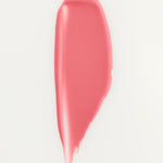 JONES + CO La Laque Tinted Lip Oil swatch in a sheer coral-pink shade. Lightweight, glossy finish.