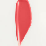 JONES + CO La Laque Tinted Lip Oil in a coral shade, a glossy balm with sheer luminous color.