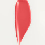 JONES + CO La Laque Tinted Lip Oil in a coral shade, a glossy balm with sheer luminous color.