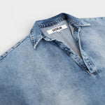 JONES + CO Lotus shirt in Malibu Wash light blue denim, featuring an open collar and wide dolman sleeves.
