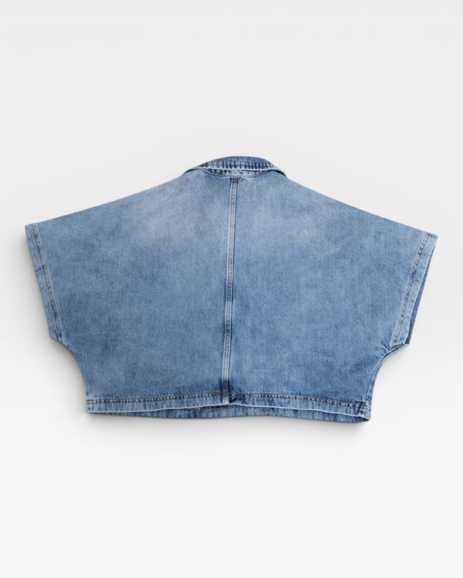 JONES + CO Lotus shirt in Malibu Wash denim. Relaxed fit, cropped top with open collar and wide dolman sleeves.