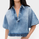 JONES + CO Lotus shirt in Malibu Wash denim, featuring an open collar, dolman sleeves, and a cropped fit.