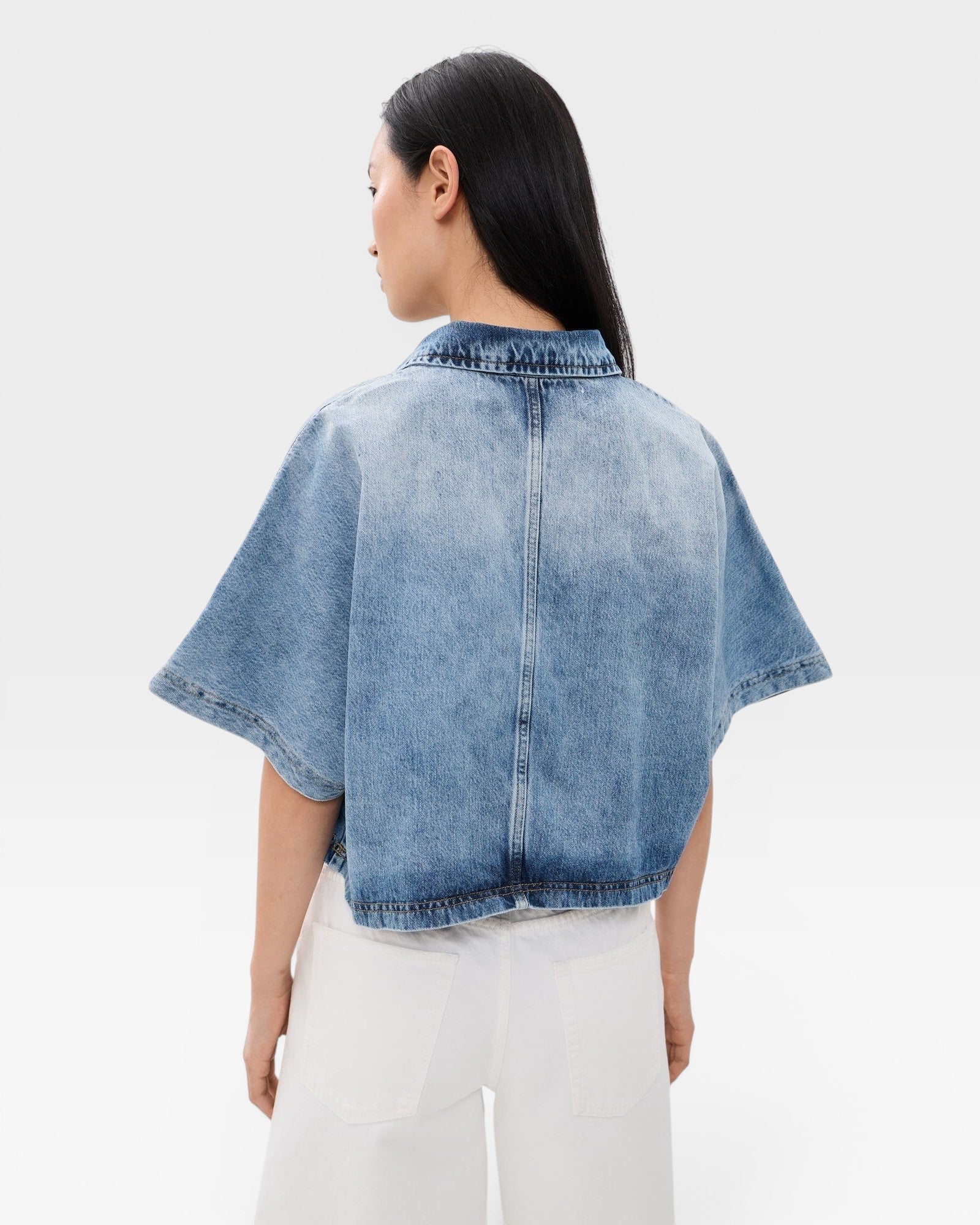 JONES + CO Lotus shirt in Malibu Wash denim, featuring a relaxed fit, open collar, and dolman sleeves.