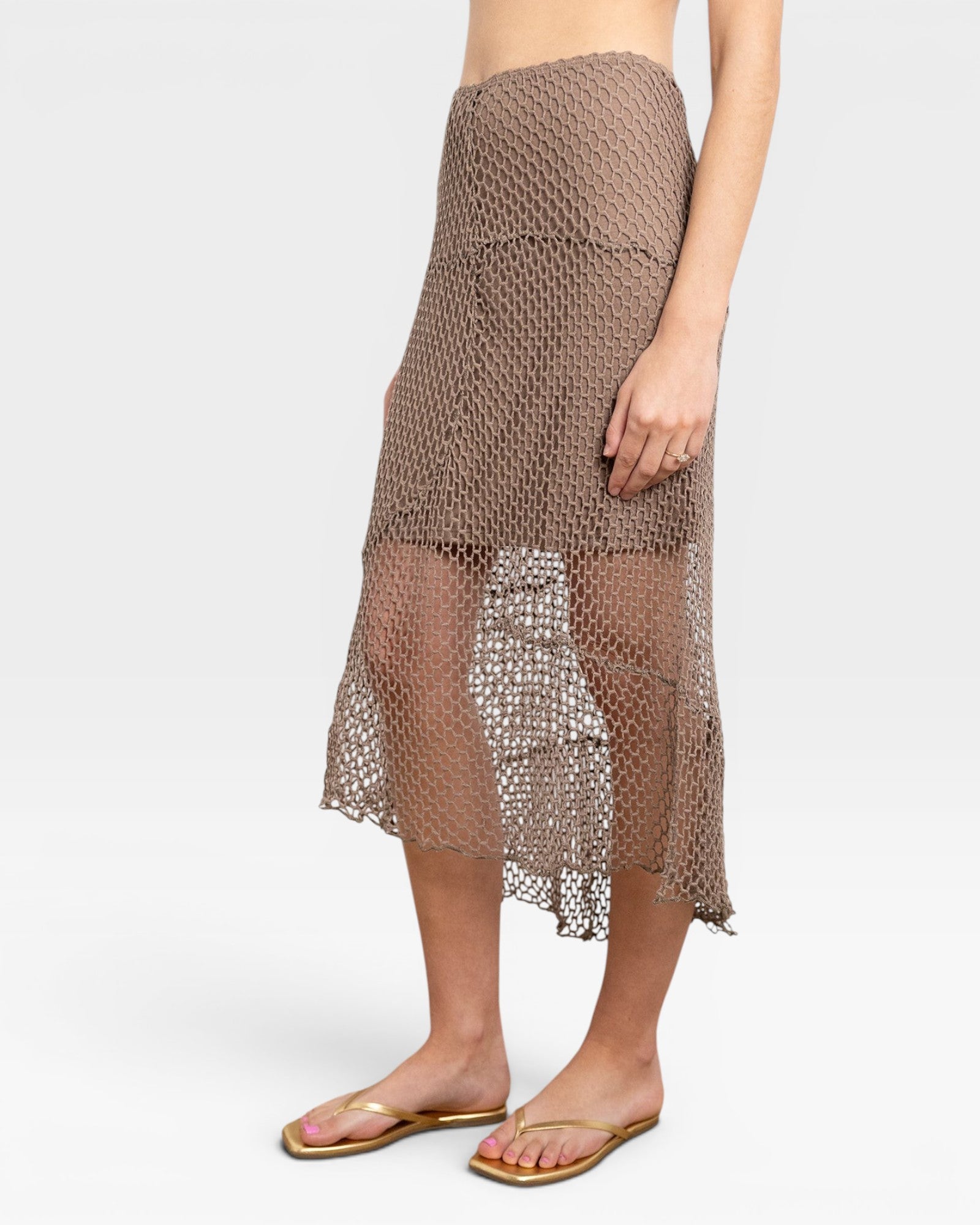 JONES + CO Louis Crochet Skirt in bark brown. Midi length, asymmetrical hem, open knit.