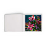 JONES + CO Lucas Samaras Flowers art book open to a page showing a vibrant, psychedelic digital floral photograph.