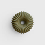 JONES + CO lülala soap bar in a sage green, fluted donut shape with organic texture and a central hole.