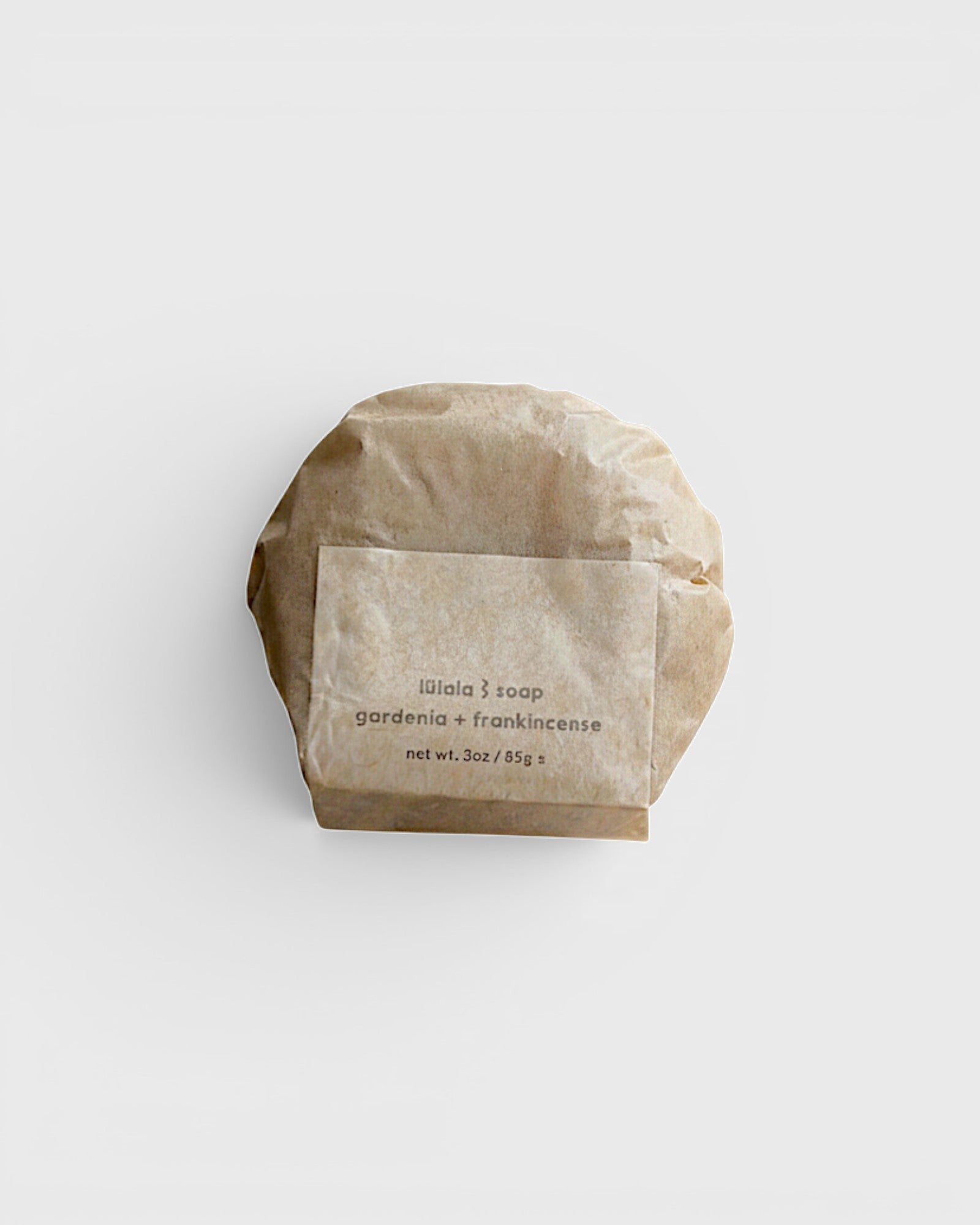 JONES + CO lülala gardenia and frankincense soap bar wrapped in sustainable brown paper packaging.