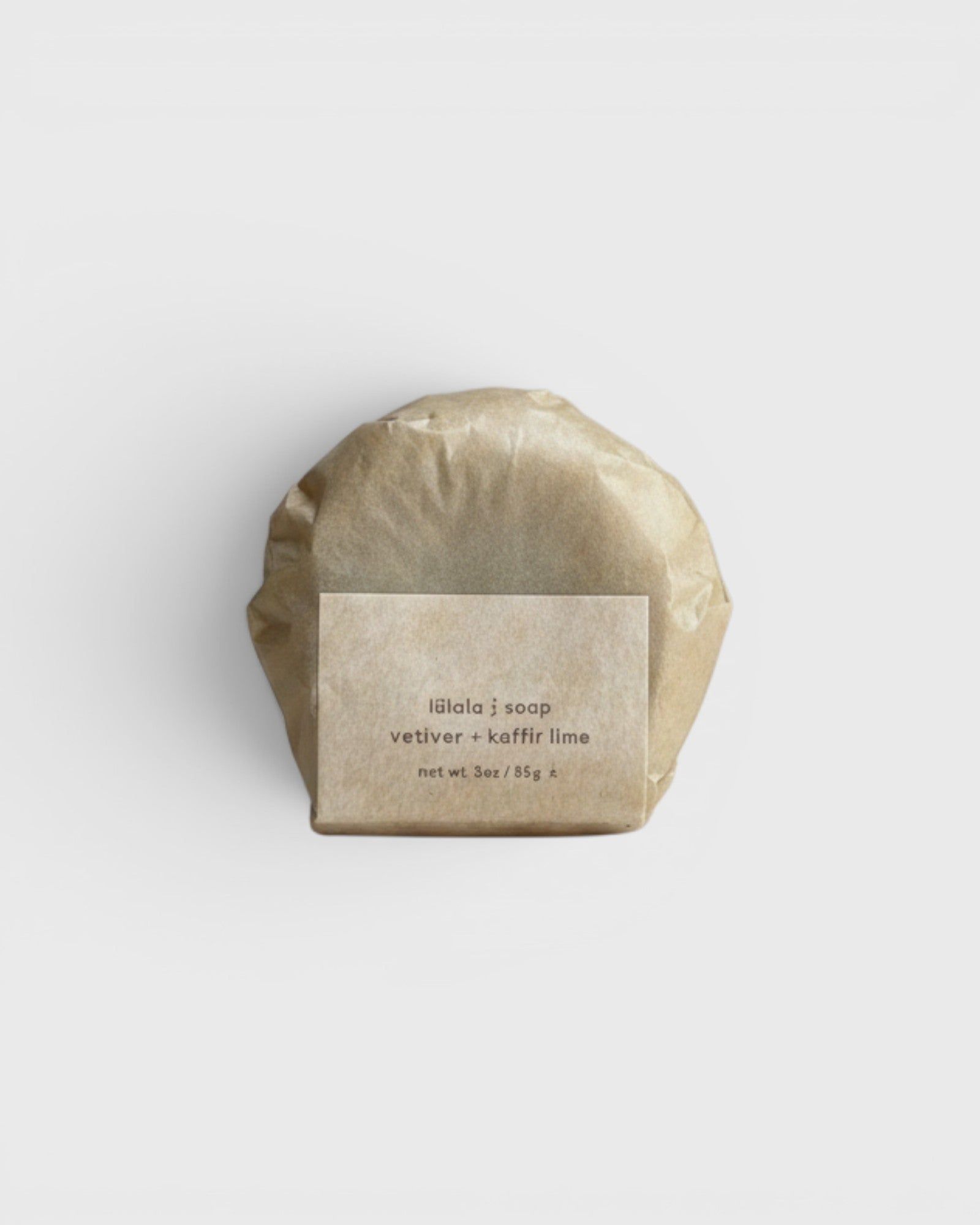 JONES + CO lülala soap bar wrapped in minimalist brown paper with a label featuring vetiver and makrut lime scent.