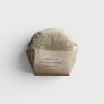 JONES + CO lülala ylang ylang and rosemary soap bar wrapped in minimalist brown paper packaging.