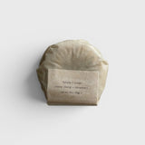 JONES + CO lülala ylang ylang and rosemary soap bar wrapped in minimalist brown paper packaging.