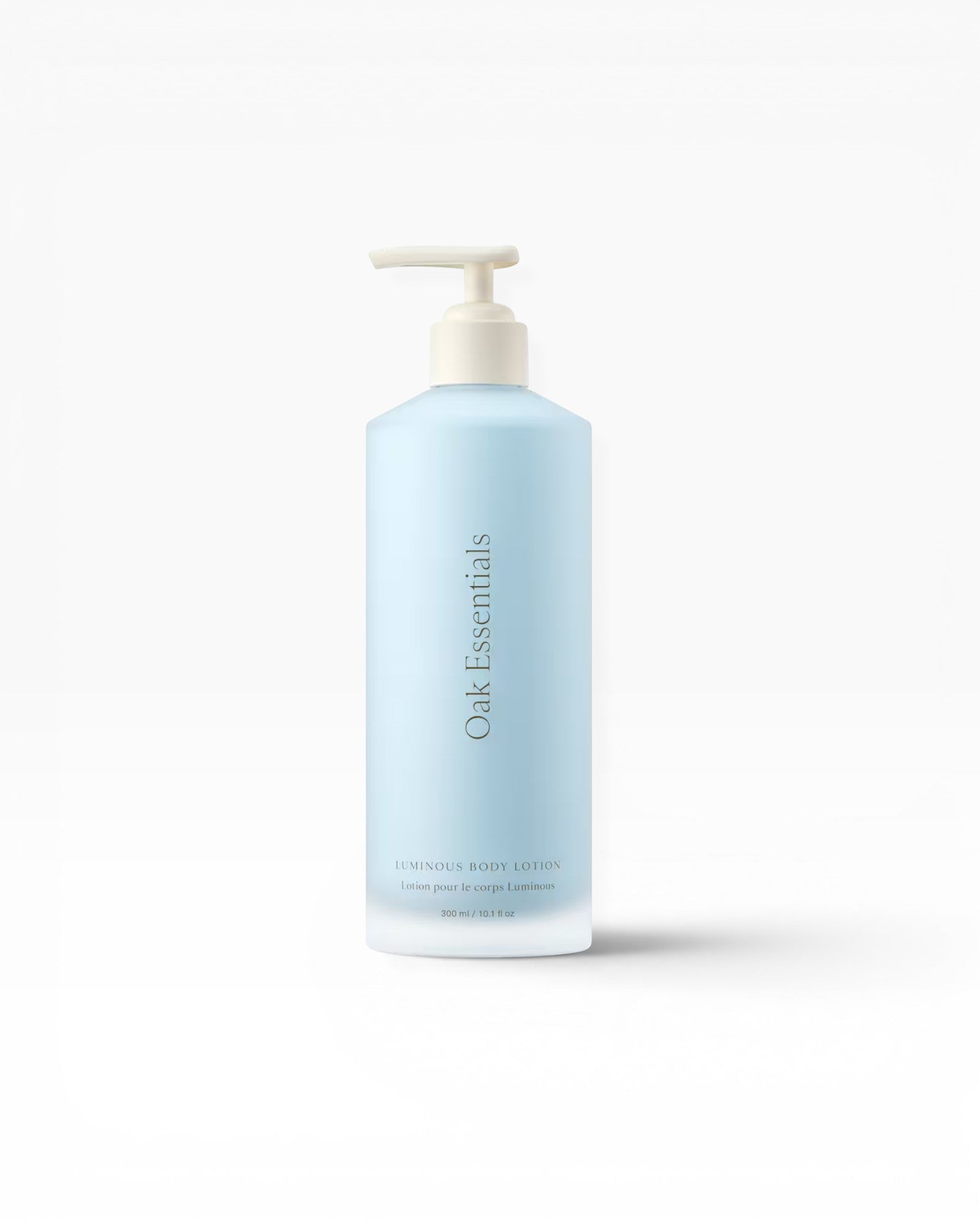 JONES + CO Luminous Body Lotion in a light blue bottle with a pump dispenser. Contains Blue Tansy.