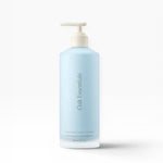 JONES + CO Luminous Body Lotion in a pale blue pump bottle with Oak Essentials branding. Contains Blue Tansy.