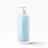 JONES + CO Luminous Body Lotion in a pale blue pump bottle with Oak Essentials branding. Contains Blue Tansy.
