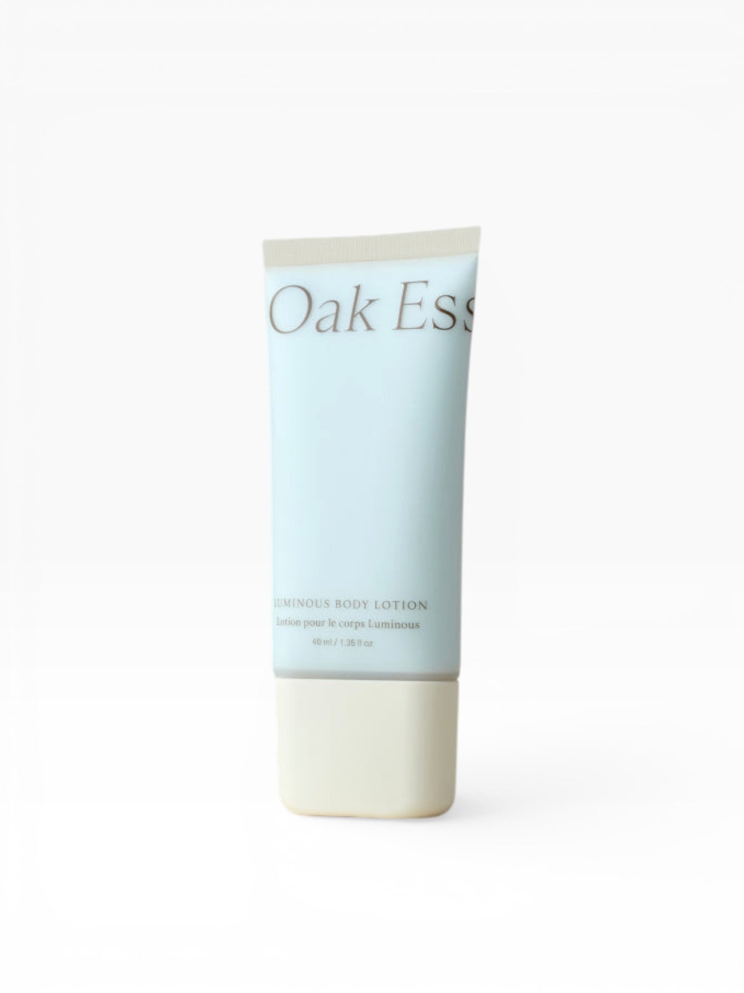 JONES + CO Luminous Body Lotion in a light blue tube with a cream base. Contains Blue Tansy, Rose Oil, Shea Butter, Coconut Oil, and Turmeric Root Extract.