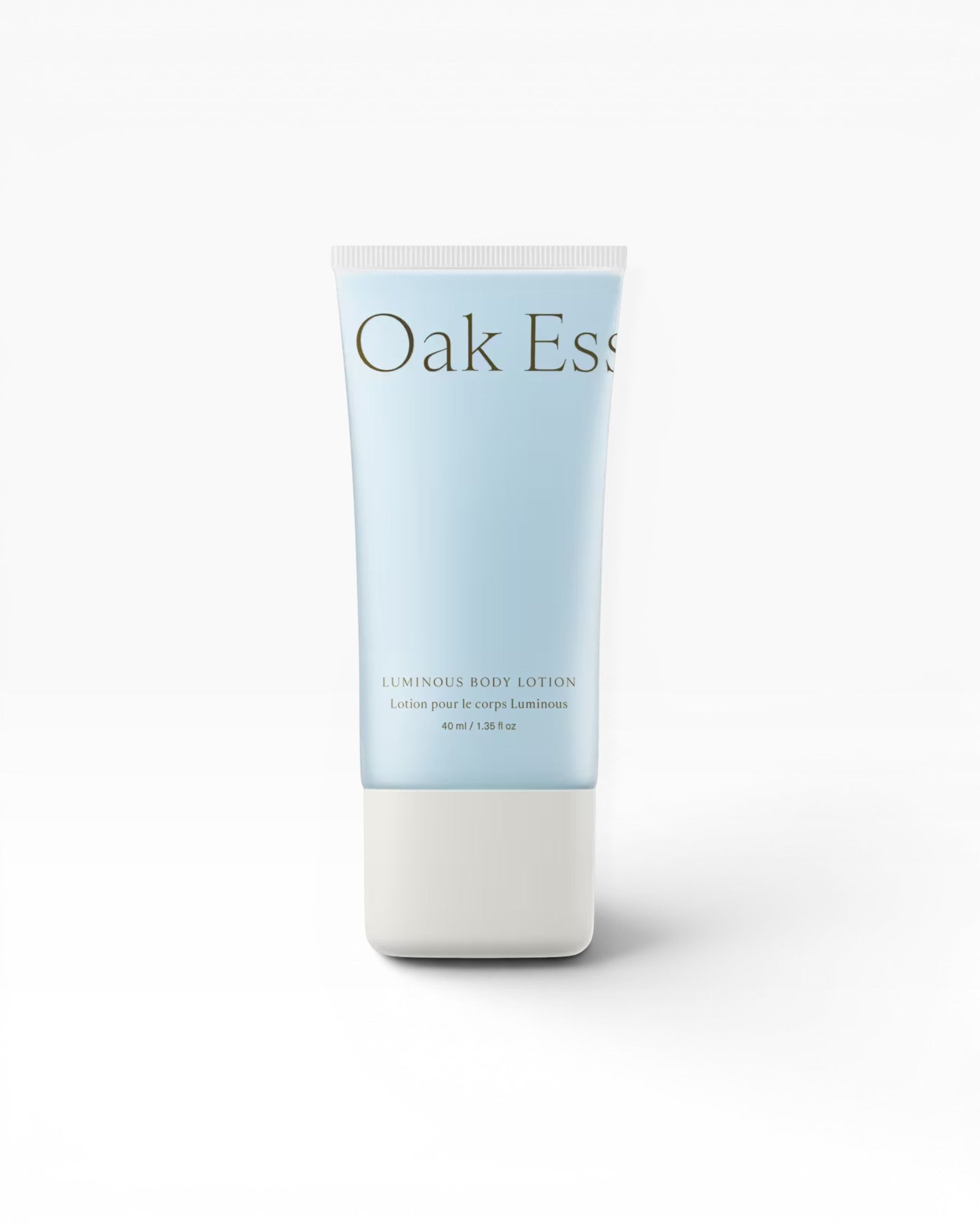 JONES + CO Luminous Body Lotion tube with blue hue, featuring antioxidant-rich Blue Tansy, Rose Oil, Shea Butter, and Coconut Oil.