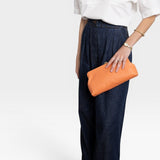 JONES + CO Manuela Classic Clutch in orange vegetable-tanned cowhide leather with vintage clasp.
