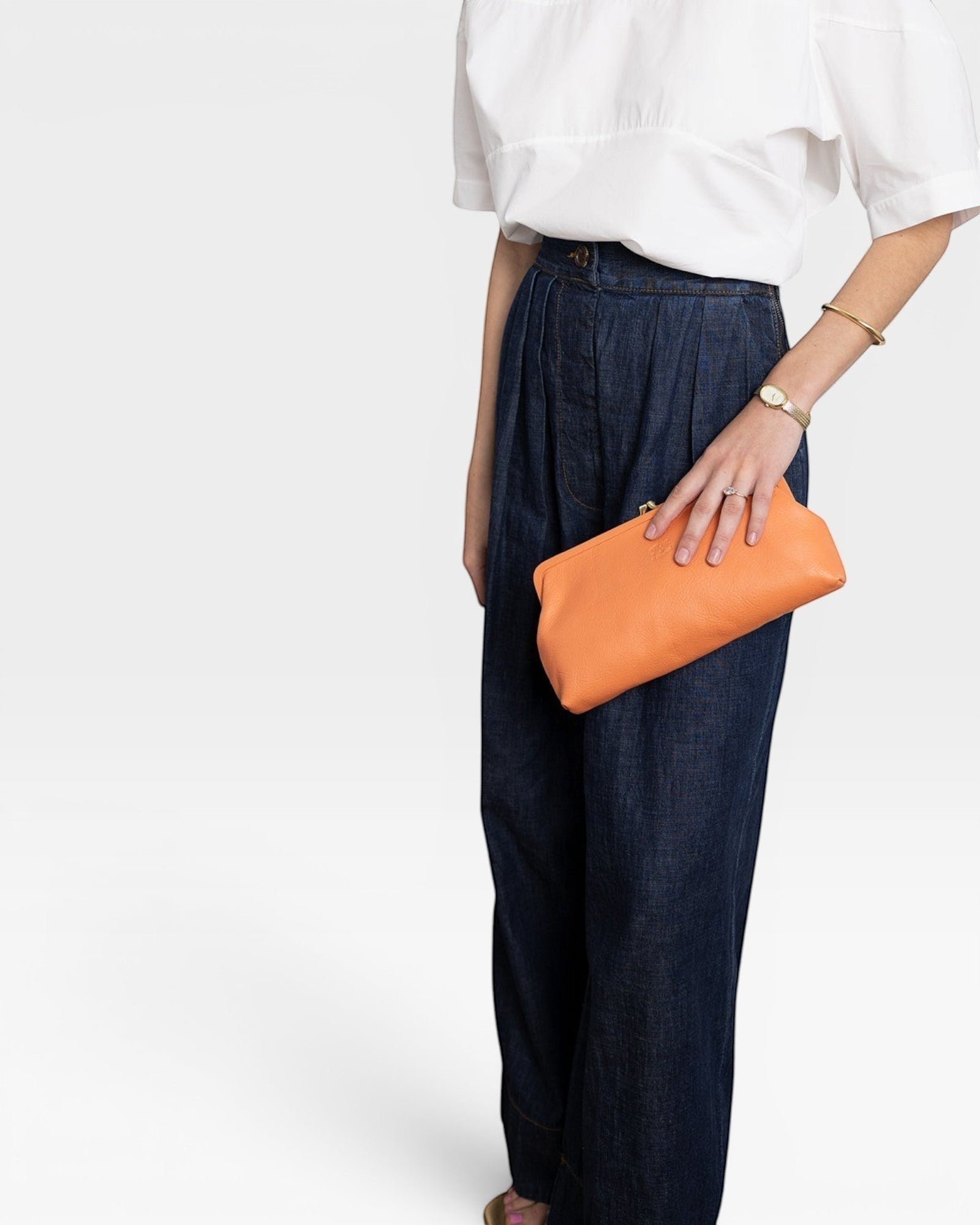 JONES + CO Manuela Classic Clutch in orange vegetable-tanned cowhide leather with vintage clasp.