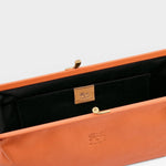 JONES + CO Manuela Classic Clutch in orange vegetable-tanned cowhide leather with vintage clasp and cotton lining.