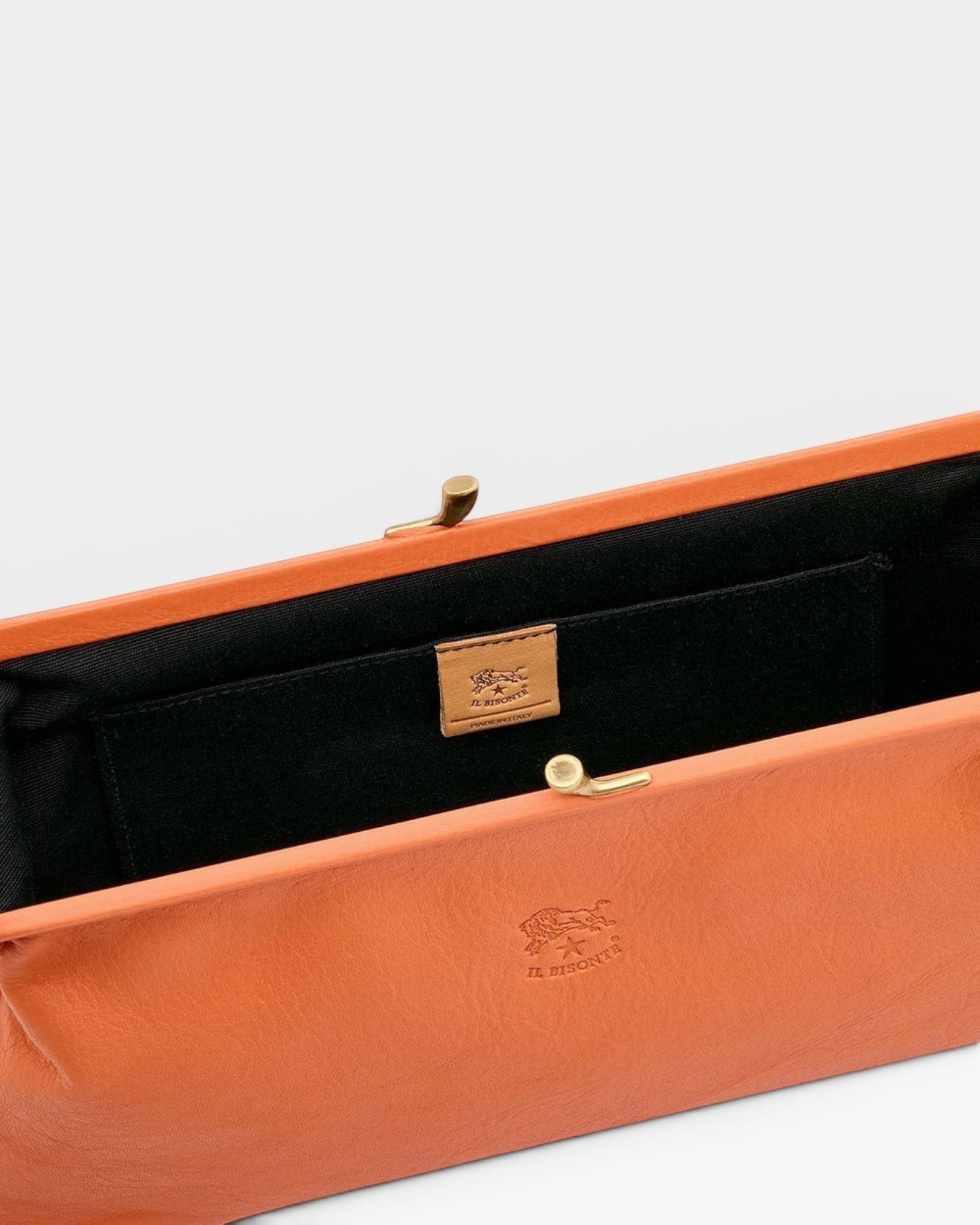 JONES + CO Manuela Classic Clutch in orange vegetable-tanned cowhide leather with vintage clasp and cotton lining.