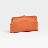JONES + CO Manuela Classic Clutch in orange vegetable-tanned cowhide leather with vintage clasp and embossed logo.