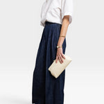 JONES + CO Manuela Classic Clutch in milk white pebbled leather with vintage clasp. Holds a phone and wallet.